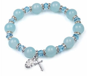ROUND AQUA COLORED GLASS BEAD STRETCH BRACELET W/ CRUCIFIX AND MIRACULOUS MEDAL CHARMS
